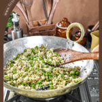 A bowl of Banarasi Chura Matar garnished with coriander and served hot