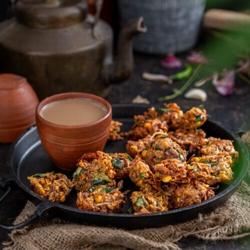 Close-up of crispy Raw Jackfruit Chana Dal Fritters made with tender raw jackfruit, chana dal, onions, and curry leaves.