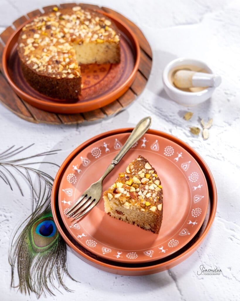 Sliced Panchamrut cake with nuts and cardamom