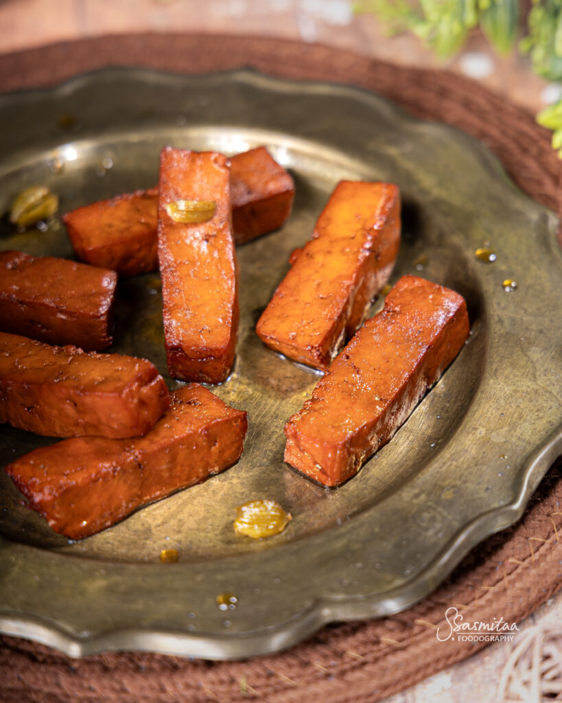 Close-up view of the texture and sugar coating of Chhena Muduki